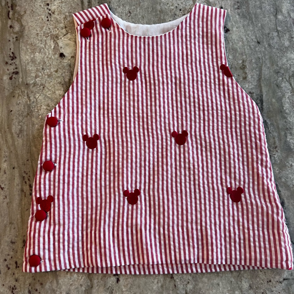 Red/white pin striped top with Mickey heads on it